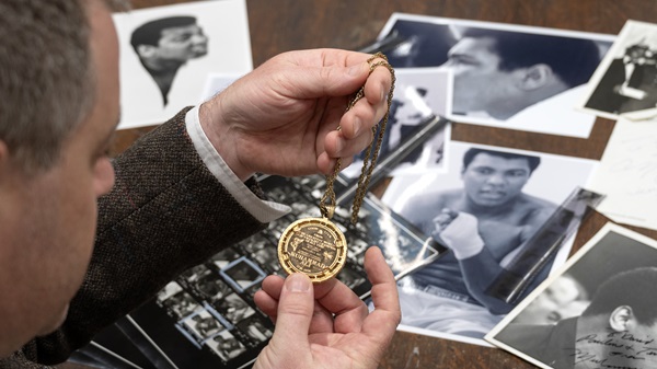 Expert valuer Edd Thomas with some of the Muhammad Ali items coming up for auction